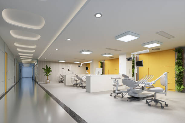치과 의사 의자, 치과 도구, 노란색 캐비닛 및 식물이있는 오픈 플랜 치과 클리닉의 인테리어. - x ray light 뉴스 사진 이미지