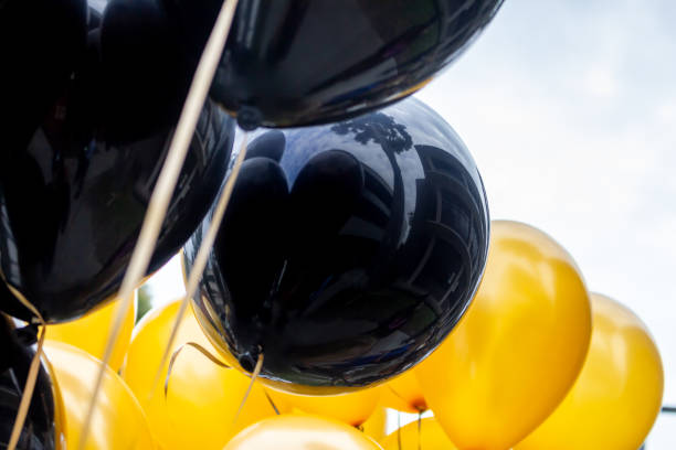 istock black gold balloons 1361838537