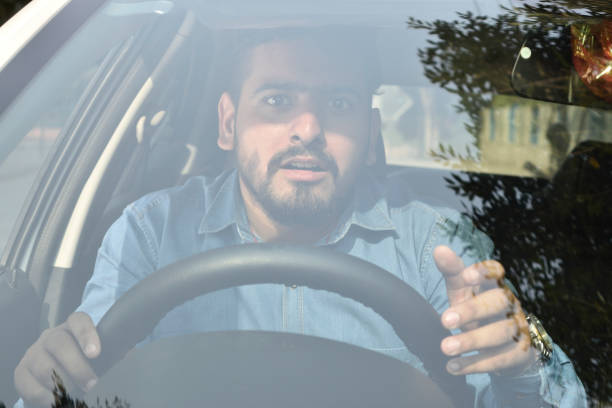 istock Young Indian man Depressed in the traffic jam 1361840932