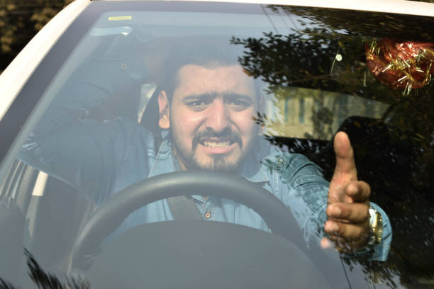Angry Driver in Road Rage and Traffic Jam stock photo