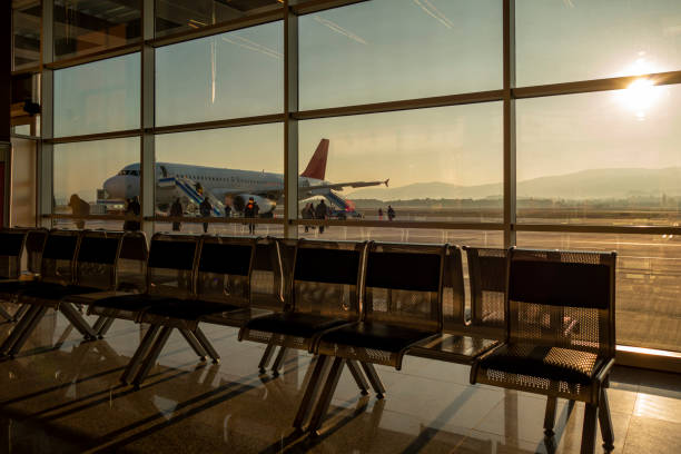 istock Airport waiting room, and plane 1361844825