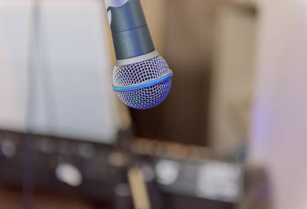 istock Concert microphone on the background of musical instruments. Selected focus Copy space. 1361845124