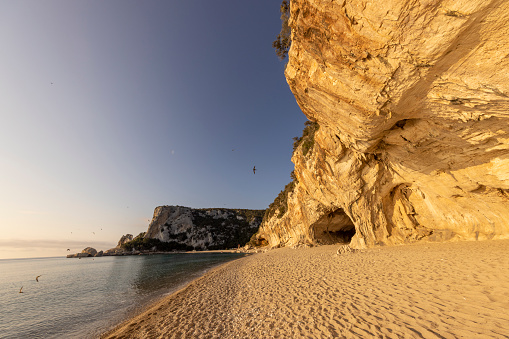 View of Cala Luna cave along the beach in summertime, Sardinia, Italy.