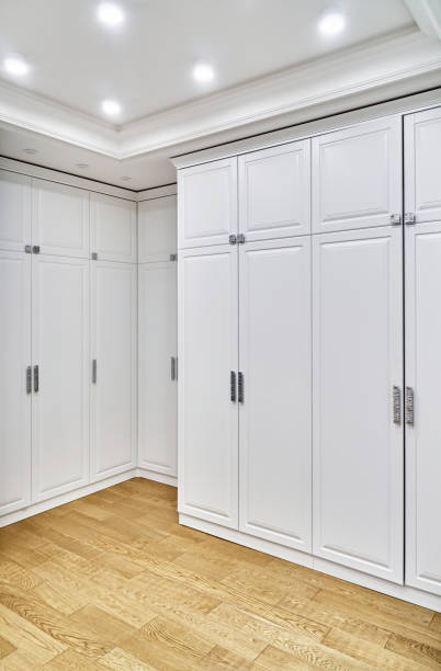 istock Spacious dressing room with classic style wardrobes 1361848085