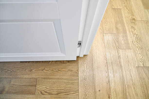 istock White open door in room with elegant oak parquet flooring 1361848116