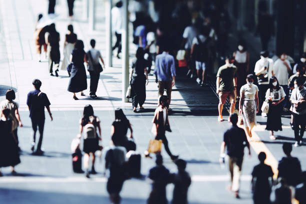 istock Many people walking in the downtown area 1361849768