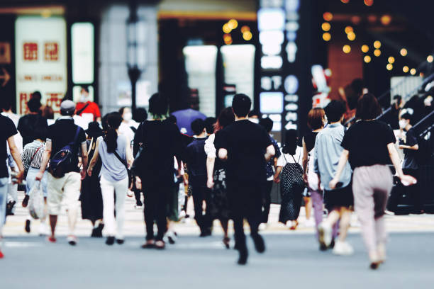 istock Many people walking in the downtown area 1361849794