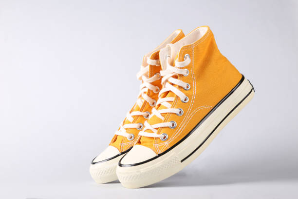 istock Classic old school sneakers on gray background 1361851258