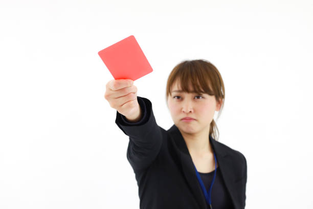 istock Female employee issuing a red card 1361851341