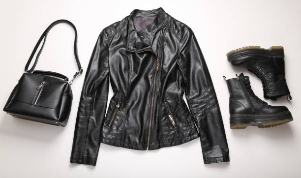 istock Stylish women's leather jacket, bag and boots on white background. Top view. Flat lay 1361851343