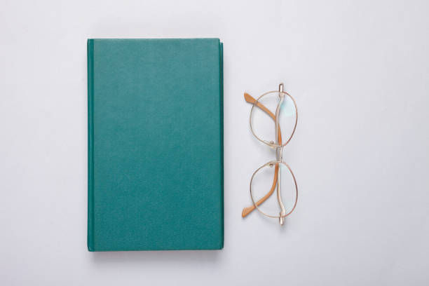 istock Book and optical eye glasses on gray background 1361852424