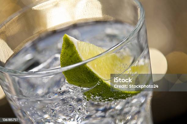 Gin Tonic Cocktail In Glass With A Brown Gold Background Stock Photo - Download Image Now