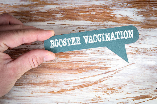 Booster Vaccination. Text on a green speech bubble.
