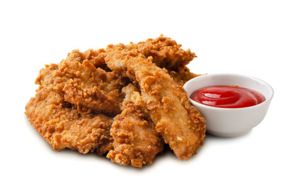 istock Delicious crispy fried chicken breast strips with tomato sauce isolated 1361861870