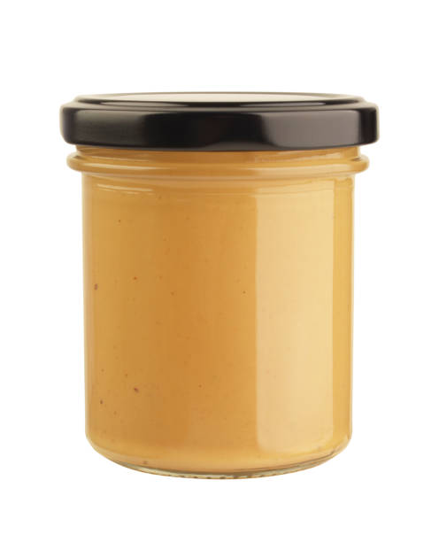 istock Peanut butter in jar isolated 1361862938