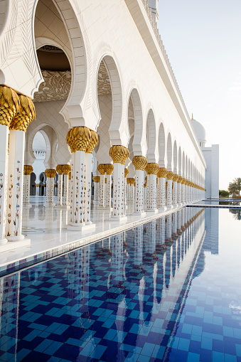 Columns of Sheikh Zayed's Mosque in Abu Dhabi reflecting in ppol