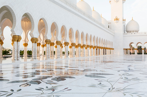 Part of Sheikh Zayed Grand Mosque central plateau with floor ornaments, embellished columns and arches surrounding