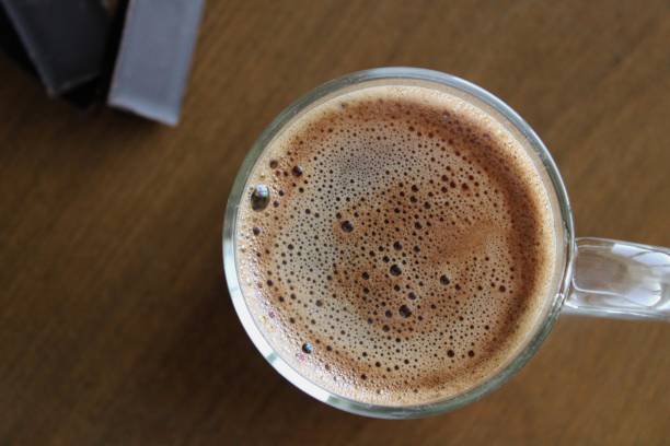 istock Cup of coffee with chocolate  on the table 1361870757