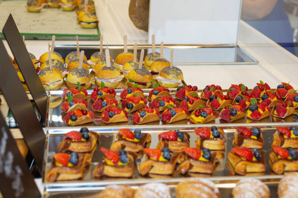 istock Fruit Pastries with Strawberries and Black Cherries and Savory Sandwiches with Cold Cuts 1361872196