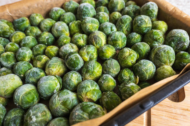 istock frozen frosty look brussels sprouts on baking tray closeup 1361876216