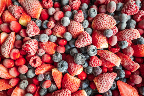 frozen mix strawberries blueberries raspberries and cranberries closeup