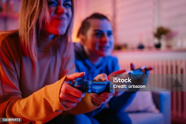 Lesbian Couple Playing Videogames Together Stock Photo - Download Image Now - Control, Video Game, Gamer