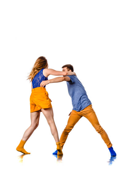 istock Dancing young couple on a white background 1361896398