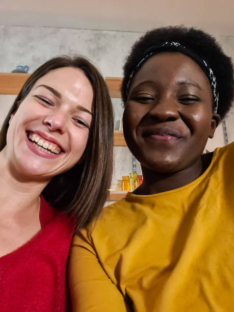 istock Female friends taking a selfie at home 1361896685