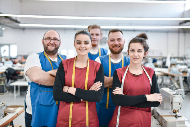 istock Smiling Work Team In Textile Factory 1361896872