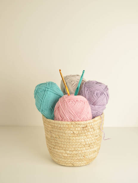 istock pastel colored woolen balls in basket with crochet hooks 1361902329