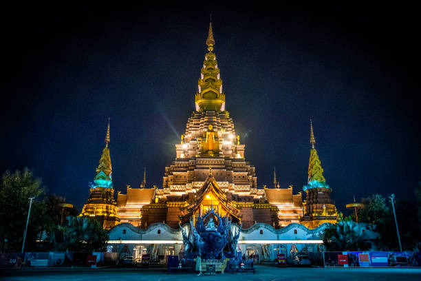 Grand Golden Pagoda In Evening In Xishuangbanna In China In Xishuangbanna In China xishuangbanna stock pictures, royalty-free photos & images