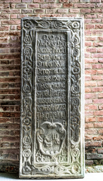 istock Ancient stone with medieval latin writing. Ancient church 1361906252