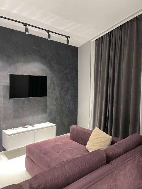 istock modern living room with sofa at tv, black wall 1361906398