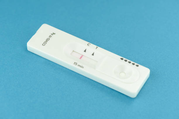 istock close view of negative antigen covid-19 test on blue background 1361907531
