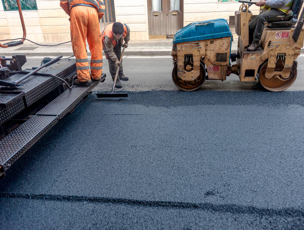 istock Heavy asphalt road roller with heavy vibration roller compactor that press new hot asphalt and asphalt paver machine on a road construction site on a street. 1361910981