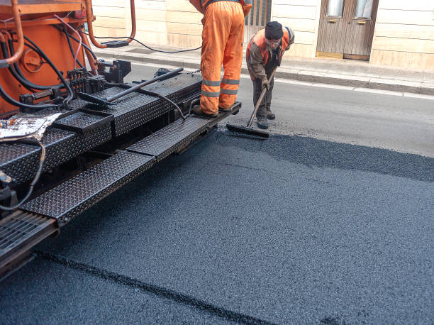 istock Heavy asphalt road roller with heavy vibration roller compactor that press new hot asphalt and asphalt paver machine on a road construction site on a street. 1361910992