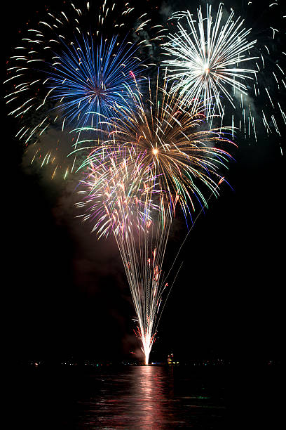 istock Beautiful colorful fireworks with night sky and lake reflections 136191273