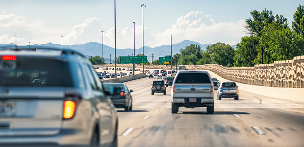 A driver's point of view of daytime traffic on Interstate 15 in Utah.