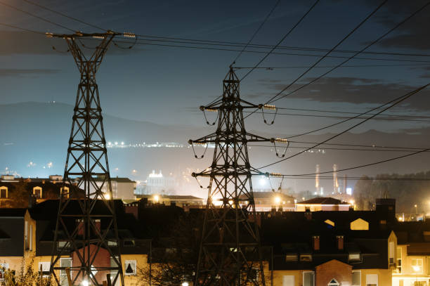 istock Electricity pylons at night 1361914813