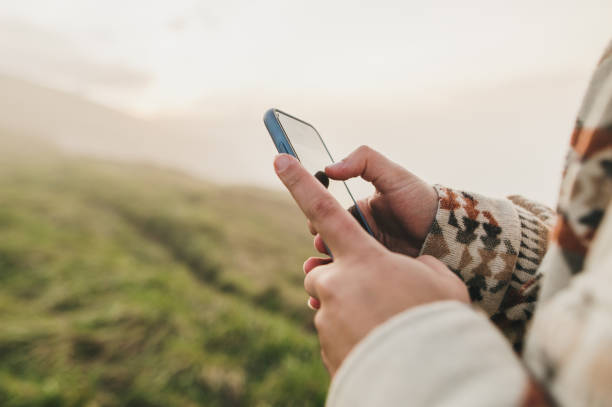 istock Close-up of hands using a smart phone 1361914865