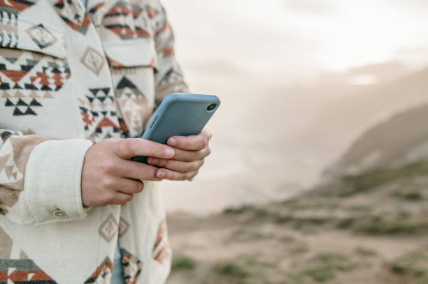 istock Close-up of hands using a smart phone 1361914932