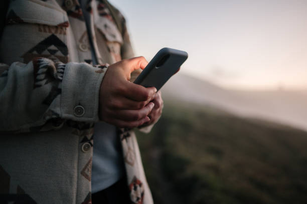 istock Close-up of hands using a smart phone 1361915005