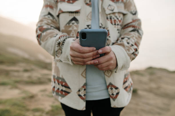 istock Close-up of hands using a smart phone 1361915043