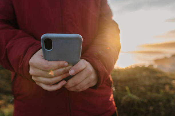 istock Close-up of hands using a smart phone 1361919329