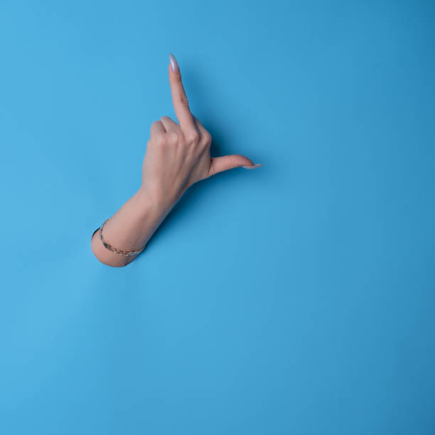 istock Middle finger, aggressive gesture. beautiful woman's hand with a manicure 1361919355