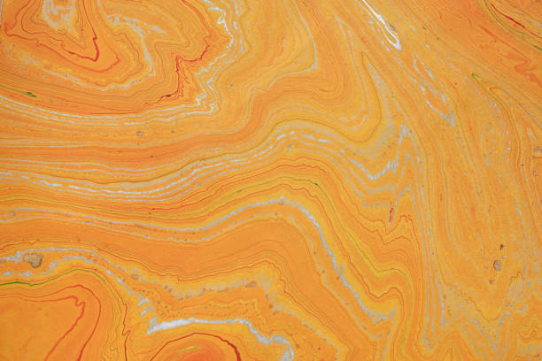 istock orange and gold marbled  paper background 1361919478