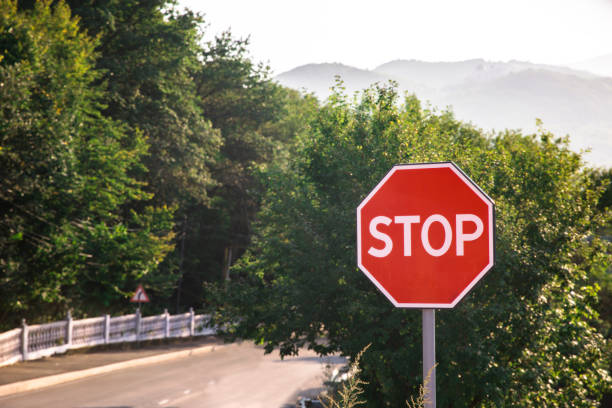 istock stop sign in the road 1361920560