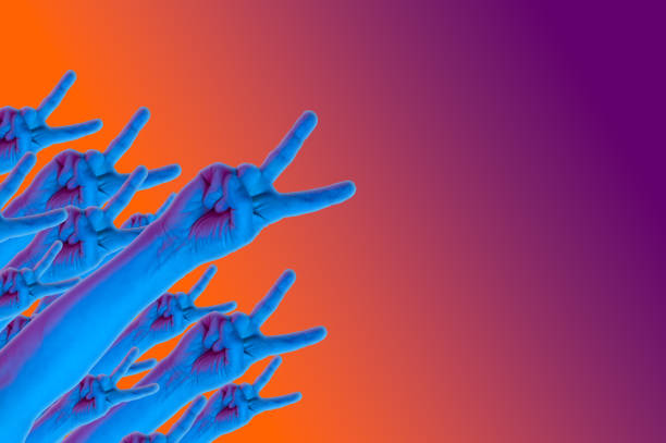 istock Victory gesture hands in a surreal style in violet blue yellow neon colors. Modern psychedelic creative element with human palm for posters, banners, wallpaper. Magazine style template. Copy space. 1361922039