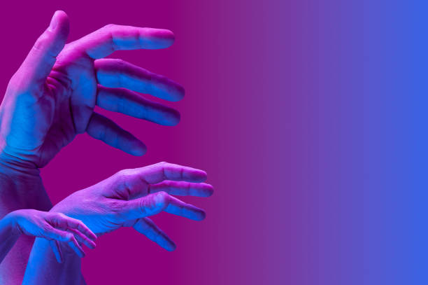 istock Hands in a surreal style in violet blue neon colors. Modern psychedelic creative element with human palm for posters, banners, wallpaper. Copy space for text. Magazine style template. Pop art culture. 1361922044