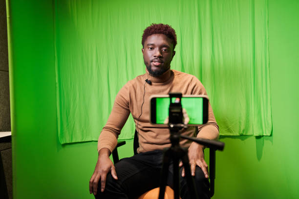 istock Television presenter in TV camera in studio over the green 1361925195
